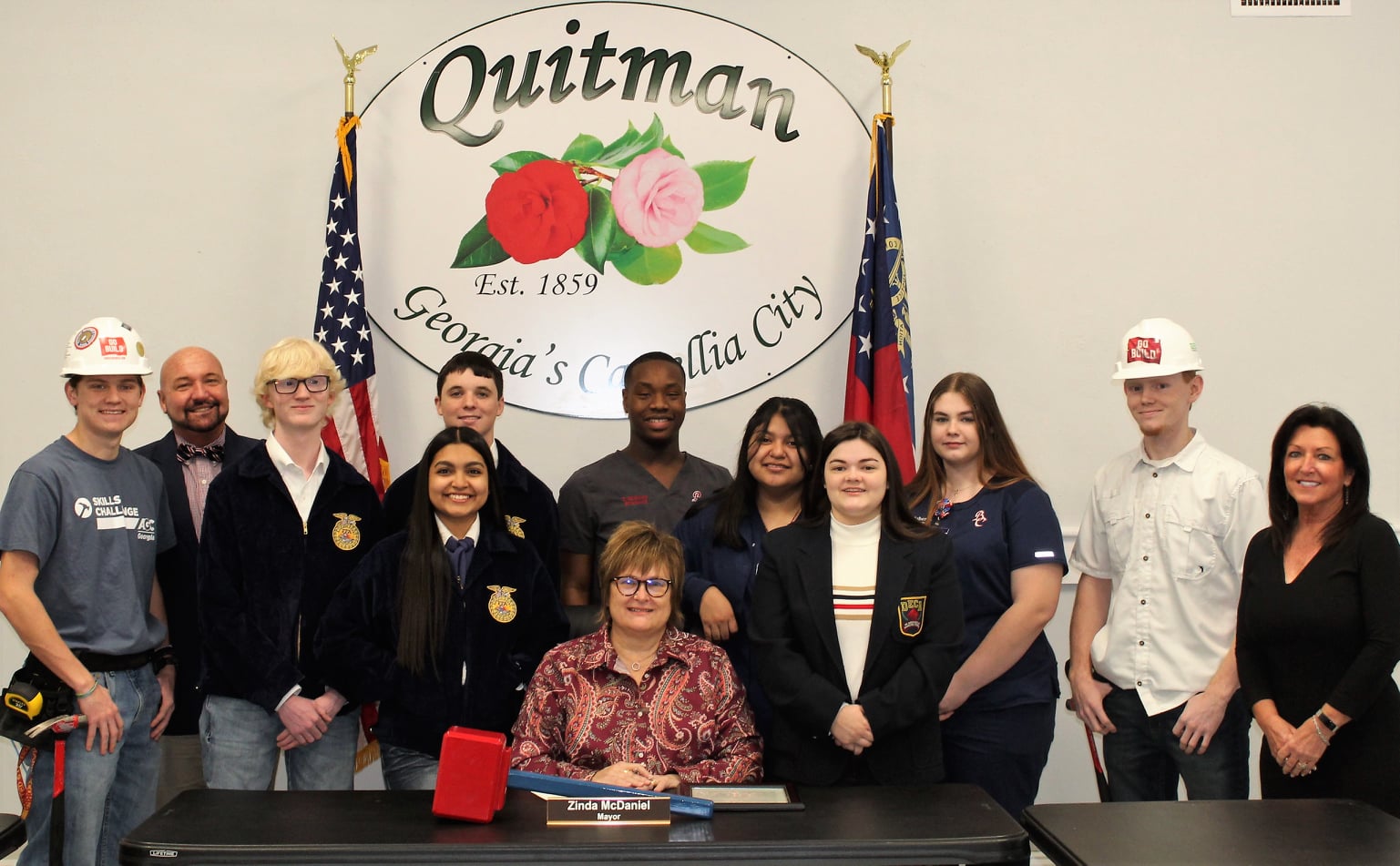 Mayor McDaniel and student members of CTAE clubs at the signing of the CTAE Month Proclamation