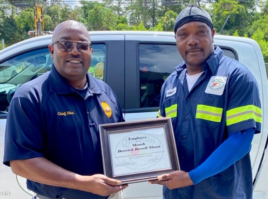 Chief Hart with Derrick Sloan, July 2022 City Employee of the Month